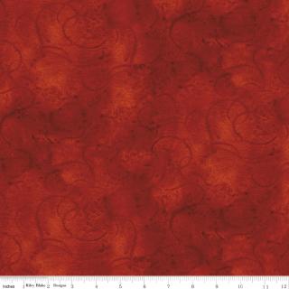 A close-up of a red-orange patterned fabric with a subtle swirling texture