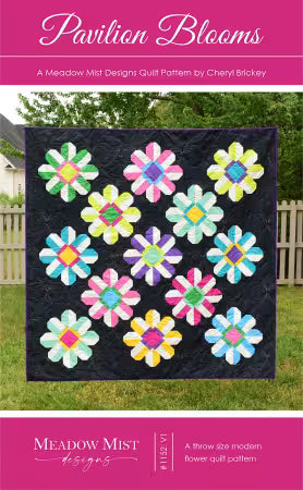 Quilt pattern cover for 'Pavilion Blooms' by Cheryl Bickley from Meadow Mist Designs, featuring a photo of a black quilt with colorful flower patches on a lawn, framed by pink title and author bands.