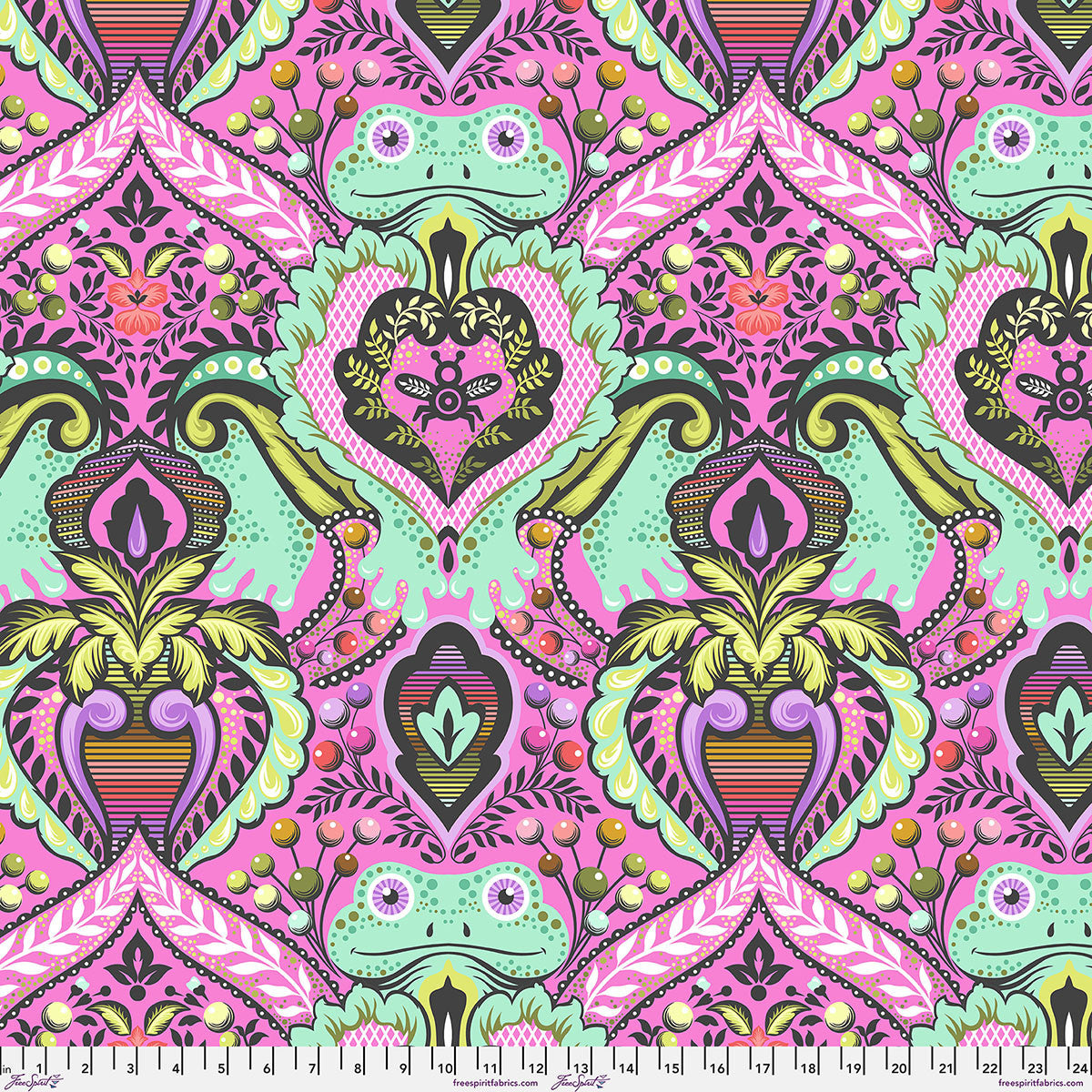 Colorful patterned fabric with frogs and geometric shapes on a pink fleece background.