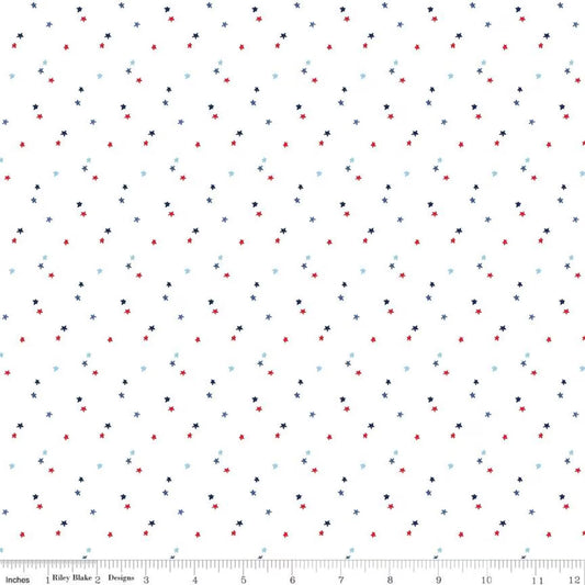 Pattern of small red, blue, and white stars on a white background