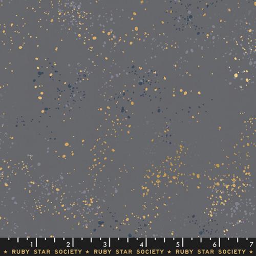 Fabric swatch with gold and blue speckles on a gray background