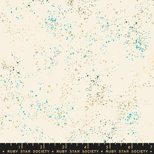 cream background with gold, teal, and aqua specks