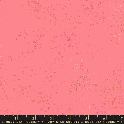 Pink fabric with small colorful specks 