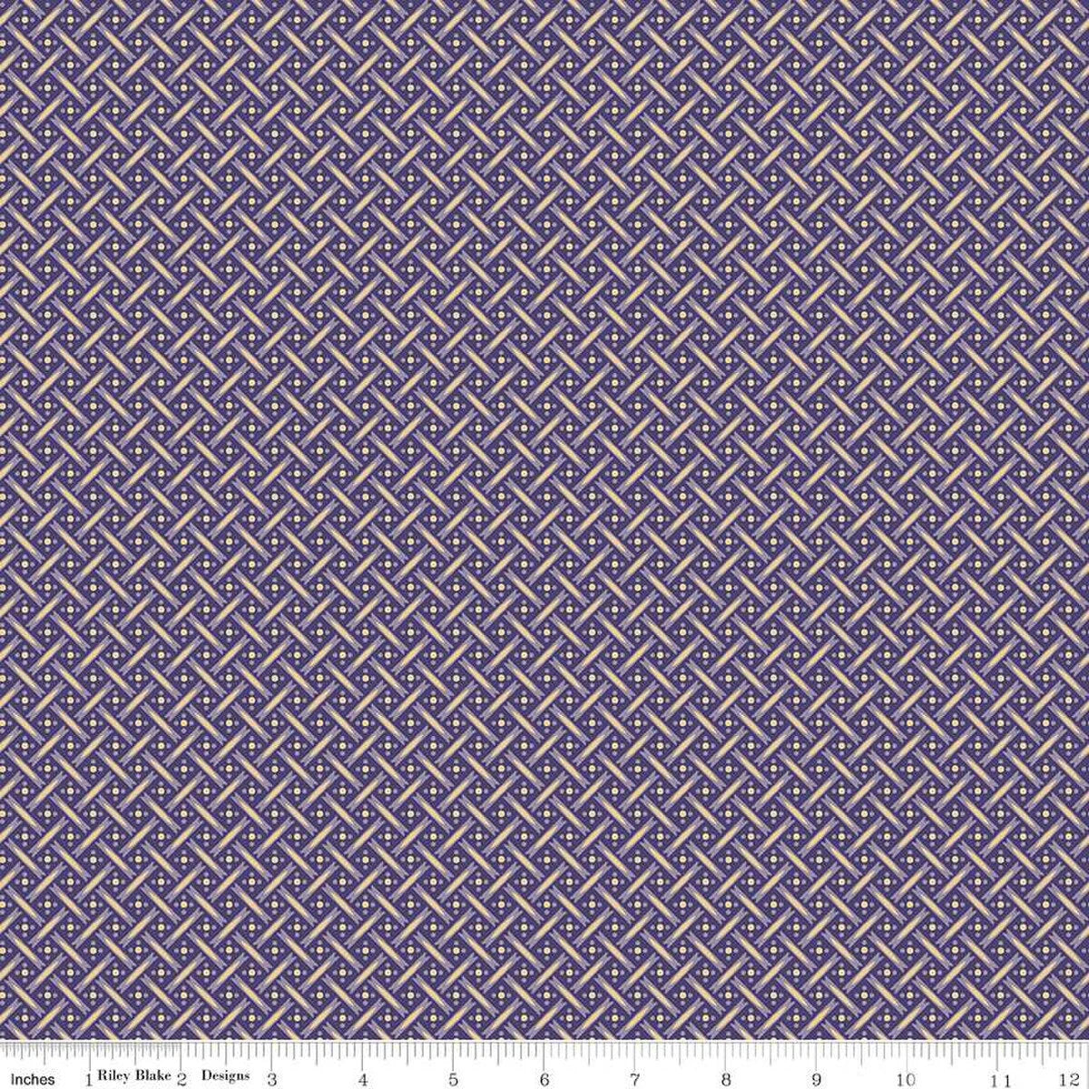 A close-up of a repeating geometric fabric pattern in purple and beige