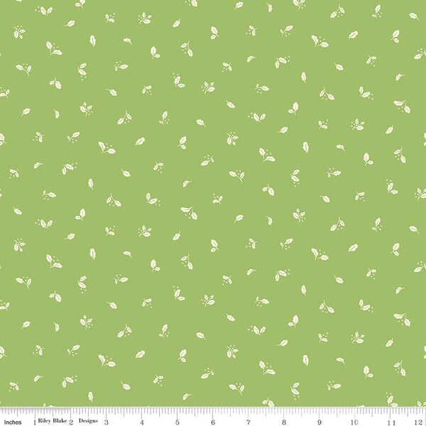 A repeating fabric pattern featuring small light green leaves and tiny floral motifs on a solid light green background