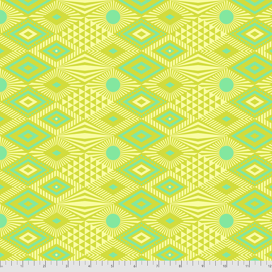 featuring a geometric pattern with green and teal diamonds, triangles, and dots on a bright yellow backing.